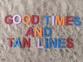 Good Times and tan lines written on sand at the beach Royalty Free Stock Photo