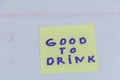 Good to drink handwritten note on yellow sticky paper Royalty Free Stock Photo