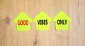 Good vibes only symbol. Concept word Good vibes only on beautiful yellow paper house. Beautiful wooden table wooden background. Royalty Free Stock Photo