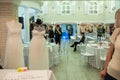 A hall of wedding exhibition and two wedding dresses