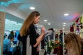 A lady checking a list at a wedding exhibition