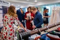 An engaged couple are making an order at a wedding exhibition