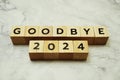 Goodbye 2024 alphabet letters on marble background