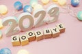 Goodbye 2023 alphabet letters with space copy on pink background