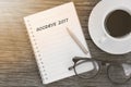 Goodbye2017 concept on notebook with glasses, pencil and coffee Royalty Free Stock Photo