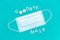Goodbye mask phrase and face mask isolated on blue background