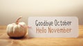 Goodbye October Hello November message with a small pumpkin Royalty Free Stock Photo