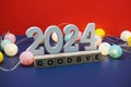 Goodbye 2024 word alphabet letters on red and blue background