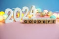 Goodbye 2024 word alphabet letters on wooden background