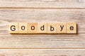 Goodbye word written on wood block. Goodbye text on table, concept Royalty Free Stock Photo