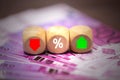 The dice show a red green arrow and the percentage of Euro Royalty Free Stock Photo