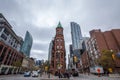 Gooderham Building, on Wellington street, surrounded by older buildings and modern financial skyscrapers.