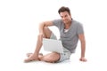 Goodlooking man using laptop smiling Royalty Free Stock Photo