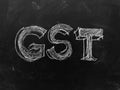 Goods & Services Tax - GST - Handwritten on Blackboard - Stock I