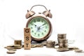 Goods and Services Tax word on Alarm clock and stacks coins on white t Royalty Free Stock Photo