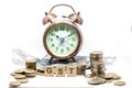 Goods and Services Tax word on Alarm clock and stacks coins on white table, Success in business