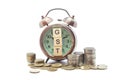 Goods and Services Tax word on Alarm clock and stacks coins on white table, Success in business