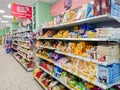 Goods on the shelf of a grocery store. Cookies, waffles, candy and other confectionery on the shelves.