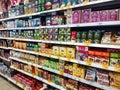 Goods on the shelf of a grocery store. Tea and coffee in cardboard boxes on the shelves