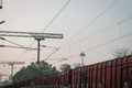 A goods train passing through railway station platform. Cargo train passing through a platform Royalty Free Stock Photo