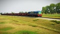 A goods train in a village with buetifull wether