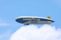 Goodyear Blimp flies above the clouds