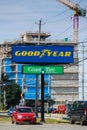 The Goodyear Tire Rubber Company banner. An American manufactures tires for passenger cars, buses, trucks, airplanes and racing