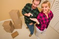 Goofy Excited Man Handing Keys to Smiling Wife