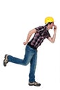 Goofy tradesman holding an object