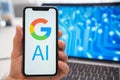 Google AI logo of neural network on the screen of smartphone on the background.