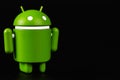 Google Android figure on a black background. Google Android is the operating system for smartphones, tablet computers, other