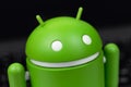 Google Android figure on notebook background macro closeup Royalty Free Stock Photo