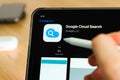 Google cloud search logo shown by apple pencil on the iPad Pro tablet screen. Man using application on the tablet. December 2020, Royalty Free Stock Photo