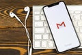 Google Gmail application icon on Apple iPhone X smartphone screen close-up. Gmail app icon. Gmail is popular Internet online e-ma