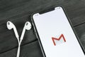 Google Gmail application icon on Apple iPhone X smartphone screen close-up. Gmail app icon. Social media icon Royalty Free Stock Photo