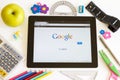 Google on Ipad 3 with school accesories Royalty Free Stock Photo