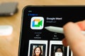 Google Meet logo shown by apple pencil on the iPad Pro tablet screen. Man using application on the tablet. December 2020, San Royalty Free Stock Photo