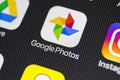 Google Photos application icon on Apple iPhone X screen close-up. Google Photos icon. Google photos application. Social media netw