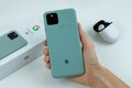 Google Pixel 5 in Sorta Sage color next to its box. Royalty Free Stock Photo