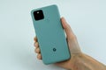 Google Pixel 5 in Sorta Sage color next to its box. Royalty Free Stock Photo