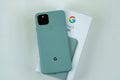 Google Pixel 5 in Sorta Sage color next to its box. Royalty Free Stock Photo
