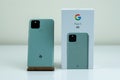 Google Pixel 5 in Sorta Sage color next to its box. Royalty Free Stock Photo