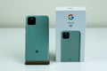 Google Pixel 5 in Sorta Sage color next to its box. Royalty Free Stock Photo
