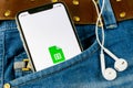 Google Sheets icon on Apple iPhone X smartphone screen close-up in jeans pocket. Google sheets icon. Social network. Social media Royalty Free Stock Photo