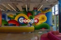 Google sign on the wall behind the reception desk at the Google headquarters in Silicon Valley