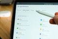 Google Workspace logo shown by apple pencil on the iPad Pro tablet screen. Man using application on the tablet. December 2020, San Royalty Free Stock Photo