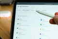 Google Workspace logo shown by apple pencil on the iPad Pro tablet screen. Man using application on the tablet. December Royalty Free Stock Photo