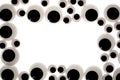 Googly eye border. A frame of funny craft toy jiggly eyes. Royalty Free Stock Photo