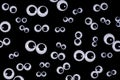 Googly eyes on black background