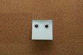 Googly eyes on clean blue sticky note on cork board concept using sticky notes Royalty Free Stock Photo
